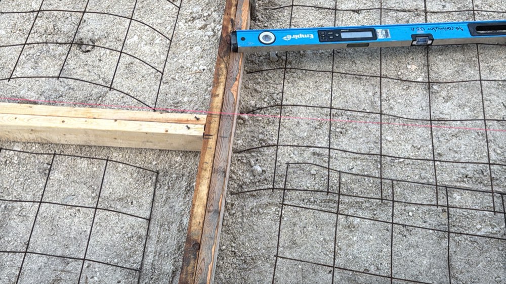 Formwork, string line and wire mesh prepared before a concrete pour